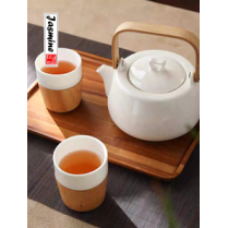 white porcelain tea set with bamboo handle