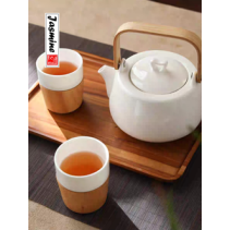 white porcelain tea set with bamboo handle