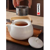 white porcelain tea set with bamboo handle