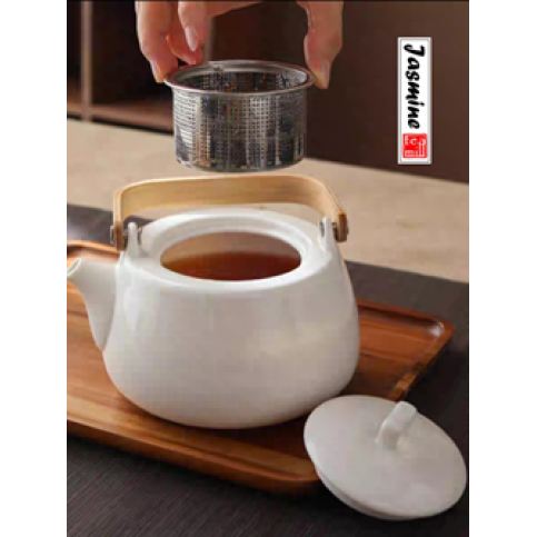 white porcelain tea set with bamboo handle